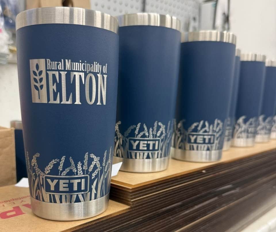 Matte blue tumblers engraved with the Rural Municipality of Elton crest